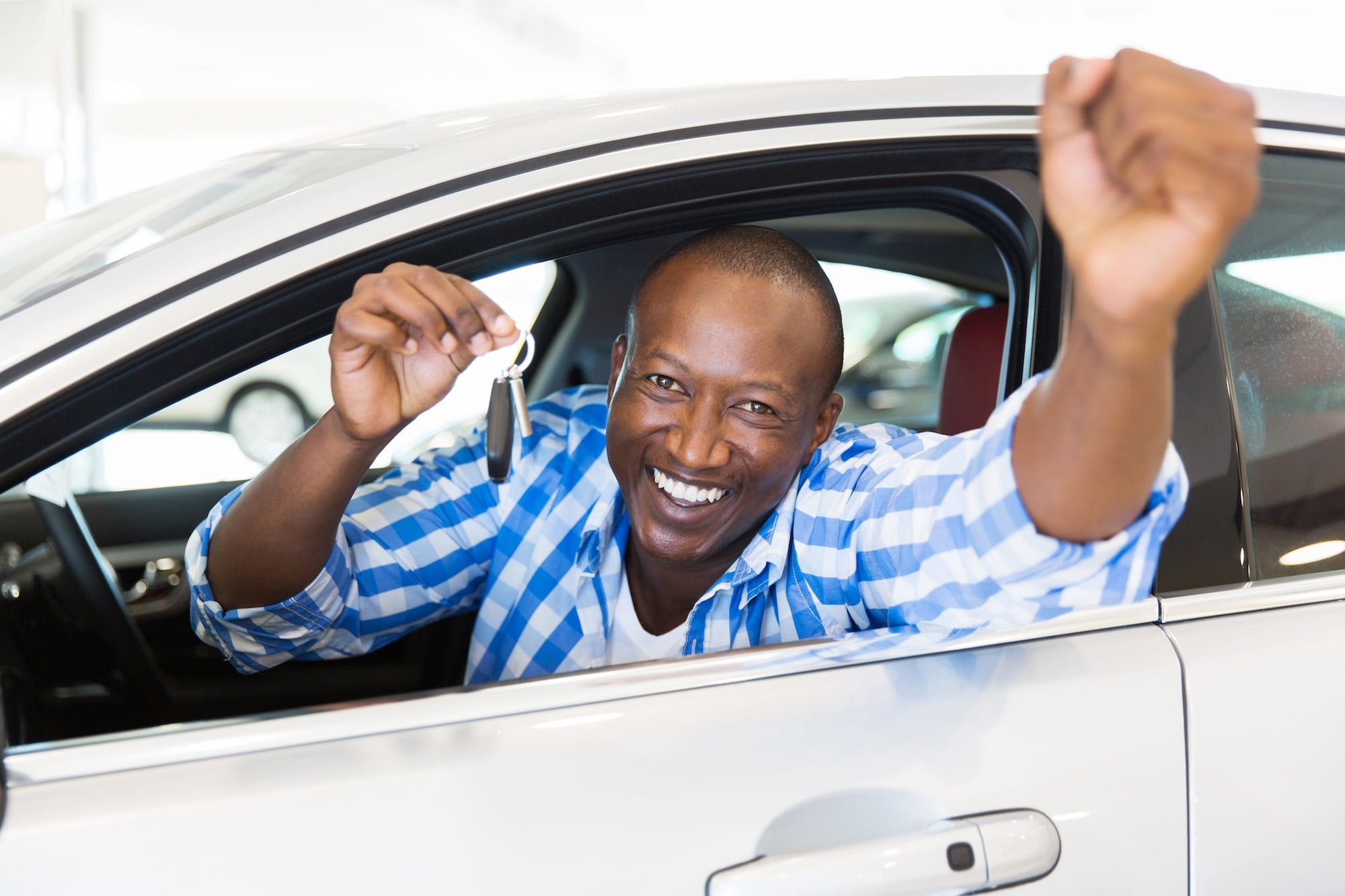 happy-man-with-key-min